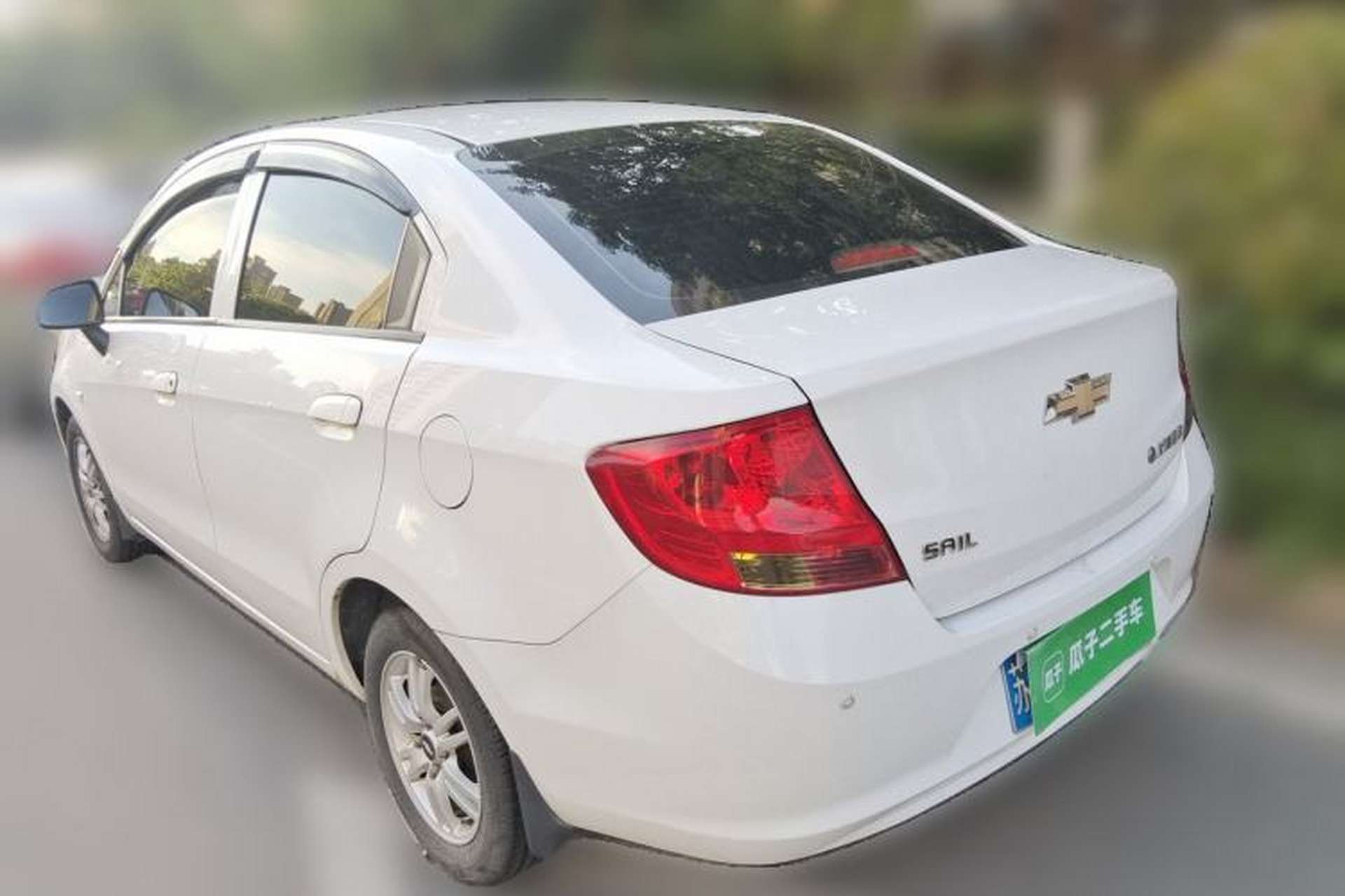 Used Chevrolet Sail 2013 Sedan 1.4L Manual Ideal Happiness Edition Rear Left 45 Deg