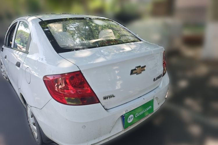 Used Chevrolet Sail 2013 Sedan 1.4L Manual Ideal Happiness Edition Rear Left 45 Deg
