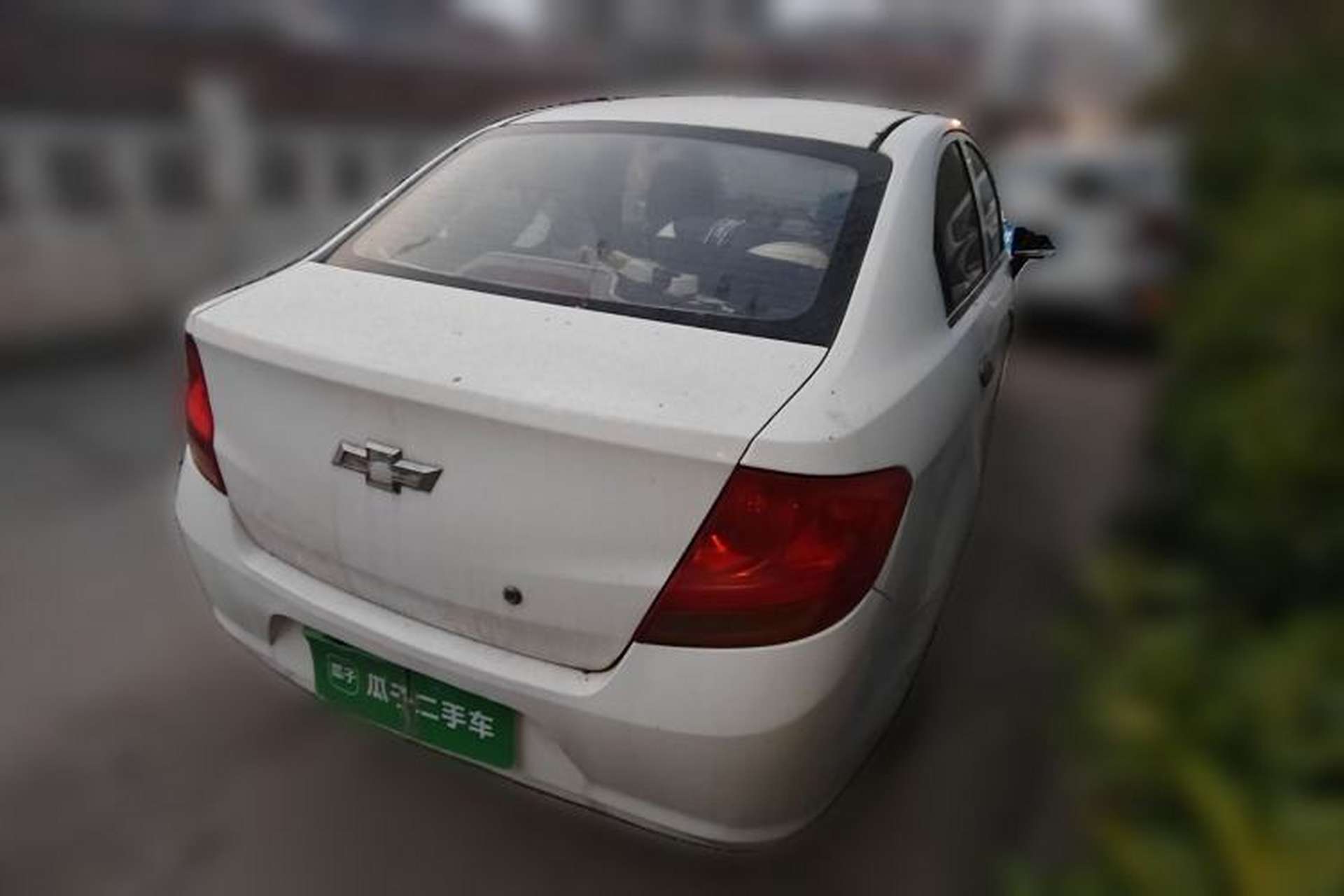Used Chevrolet Sail 2013 Sedan 1.2L Manual Fashionable Happiness Edition Rear Right 45 Deg