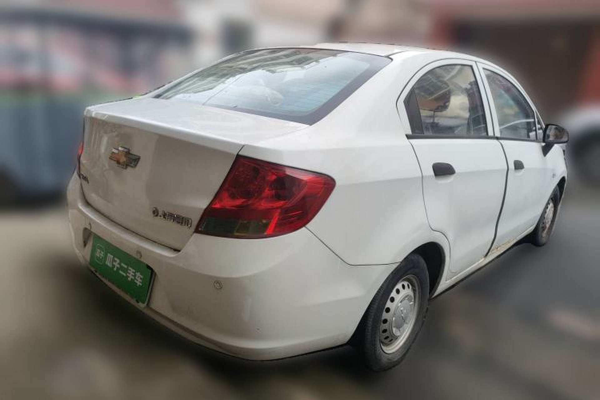 Used Chevrolet Sail 2013 Sedan 1.2L Manual Fashionable Happiness Edition Rear Right 45 Deg