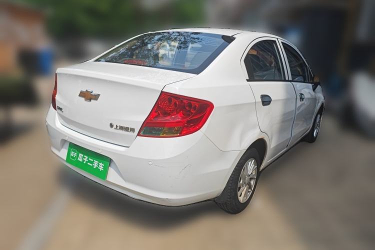 Used Chevrolet Sail 2013 Sedan 1.2L Manual Fashionable Happiness Edition Rear Right 45 Deg