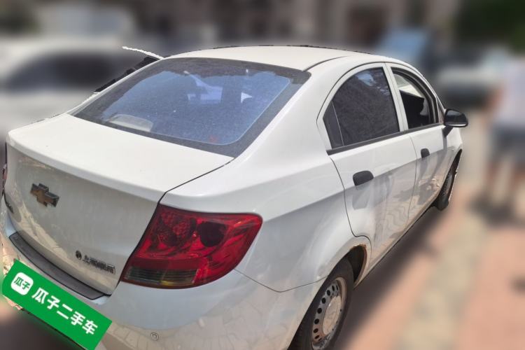 Used Chevrolet Sail 2013 Sedan 1.2L Manual Fashionable Happiness Edition Rear Right 45 Deg