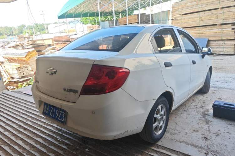Used Chevrolet Sail 2013 Sedan 1.2L Manual Fashionable Happiness Edition Rear Right 45 Deg