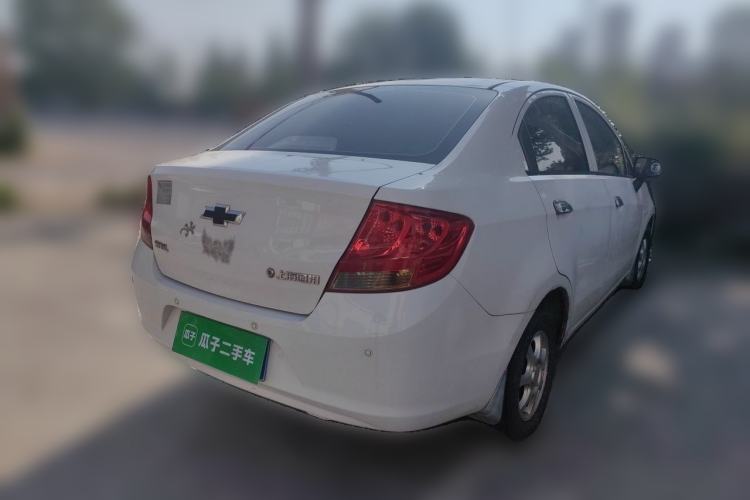 Used Chevrolet Sail 2013 Sedan 1.2L Manual Fashionable Happiness Edition Rear Right 45 Deg