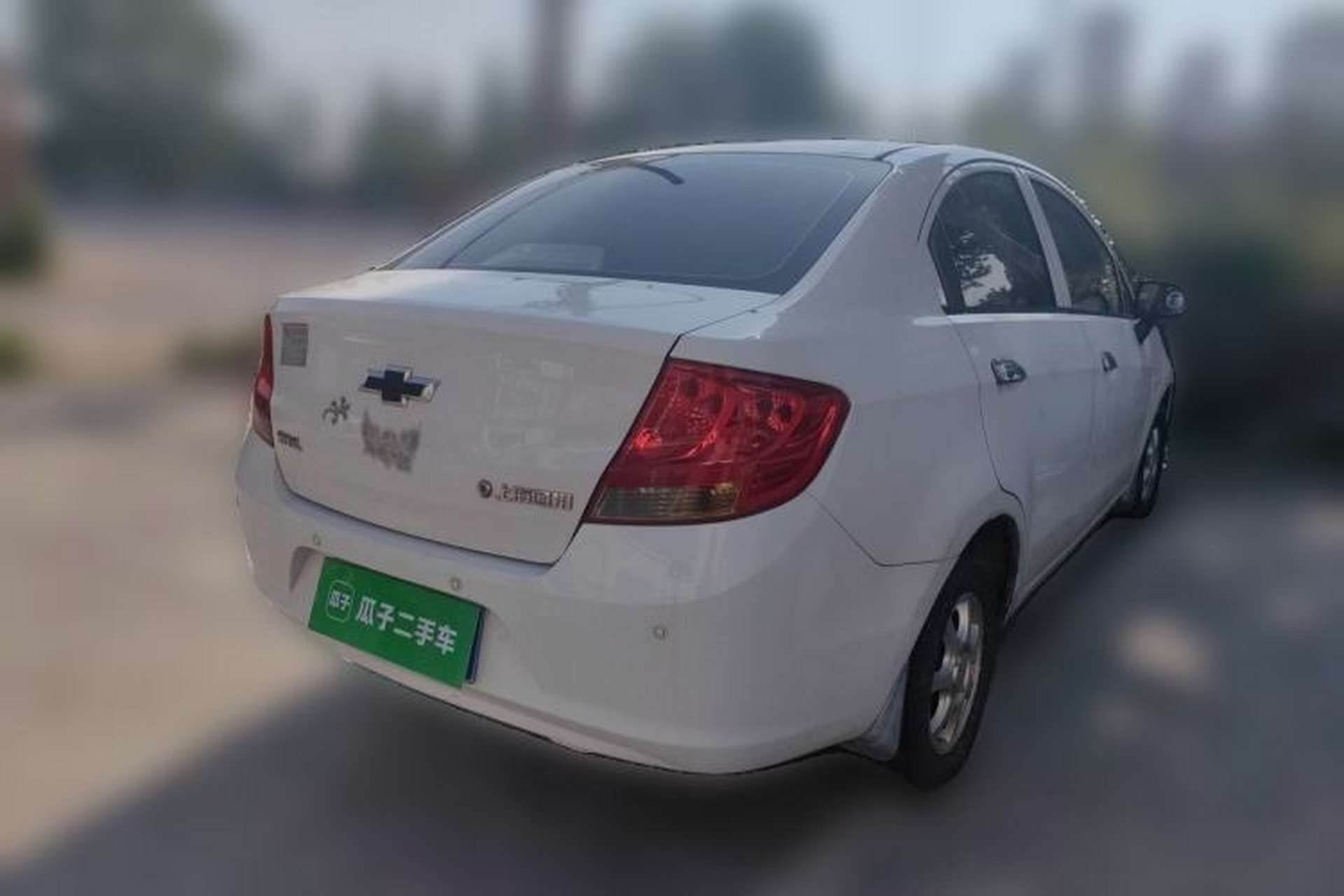 Used Chevrolet Sail 2013 Sedan 1.2L Manual Fashionable Happiness Edition Rear Right 45 Deg