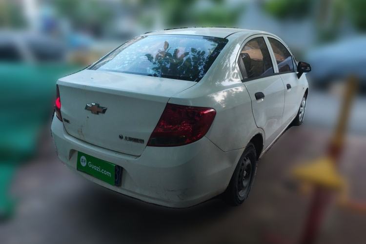 Used Chevrolet Sail 2013 Sedan 1.4L Manual Ideal Happiness Edition Rear Right 45 Deg