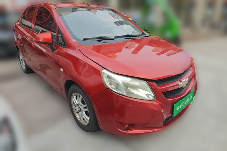 Used Chevrolet Sail 2013 Sedan 1.4L Manual Happiness Edition II Front Right 45 Deg