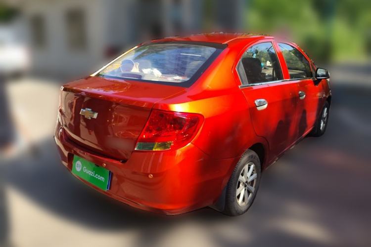 Used Chevrolet Sail 2013 Sedan 1.2L Manual Fashionable Happiness Edition Rear Right 45 Deg