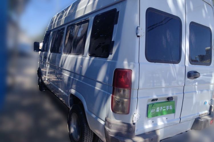 Used Iveco Daily 2021 2.5T M1 Dedicated Platform Vehicle 5-9 Seater Long Wheelbase Mid-Roof Design with Dual Tires and Side Sliding Doors Rear Left 45 Deg
