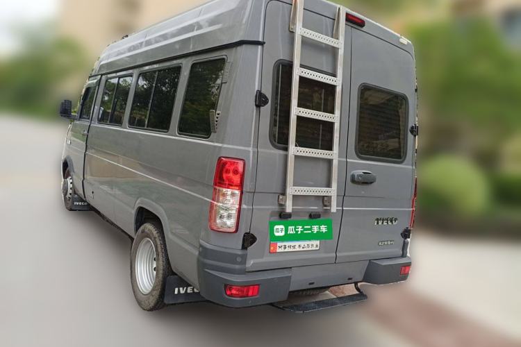 Used Iveco Daily 2022 2.5T A37 M1 Passenger Van 5-9 Seats Long Wheelbase Mid-Roof Design Dual Tires Side Sliding Doors Rear Left 45 Deg