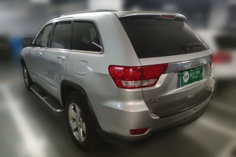 Used Jeep Grand Cherokee 2011 Revised Version 3.6L Anniversary Edition Navigation and Comfort Package Rear Left 45 Deg