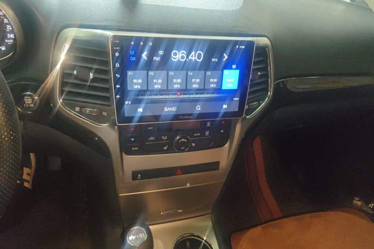 Used Jeep Grand Cherokee 2012 3.6L Comfort Navigation Edition Audio And AC Panel
