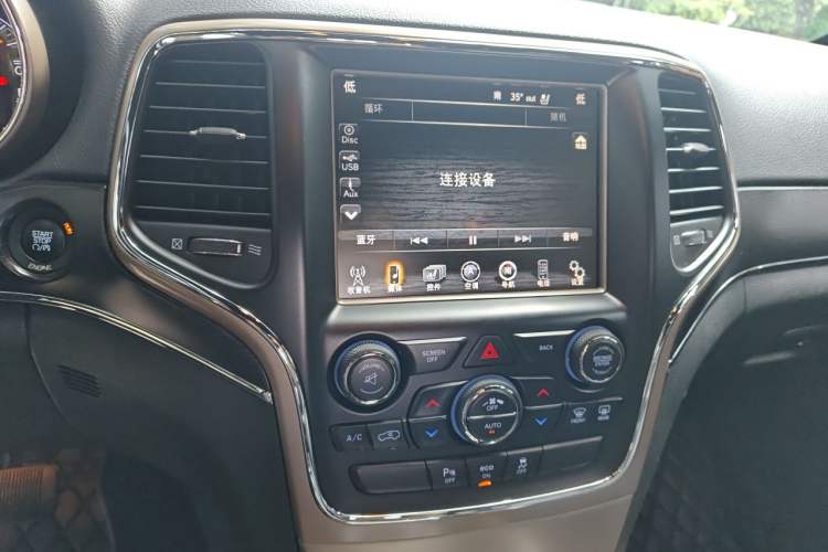 Used Jeep Grand Cherokee 2014 3.6L Elite Navigation Edition Audio And AC Panel