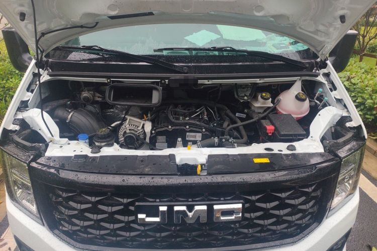 Used JMC Fushun 2023 2.0T Manual Diesel Long-Wheelbase High-Roof Business Van with Dual Rear Tires 6–9 Seats Engine Bay