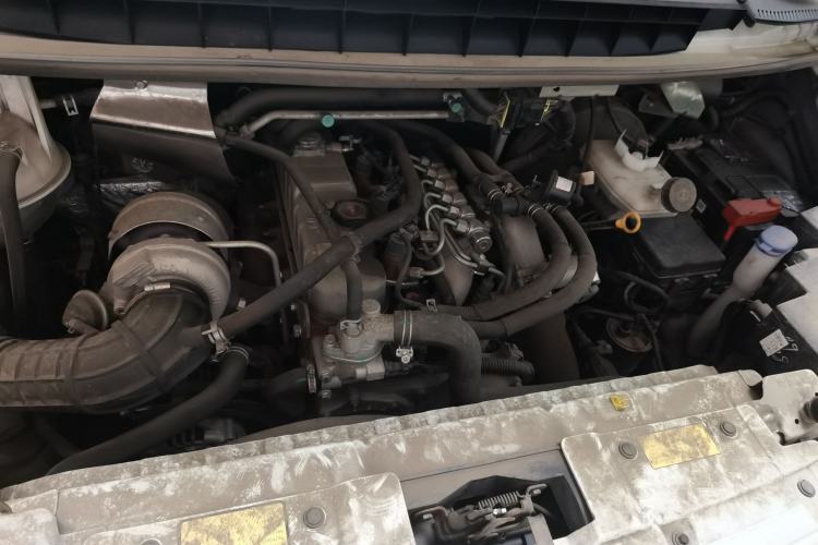 Used JMC Transit 2019 2.8T Commercial Version Intelligent Automatic Transmission Short Wheelbase Mid-Roof Design 6 Seats China VI Emission Standard – JX493 Engine Bay