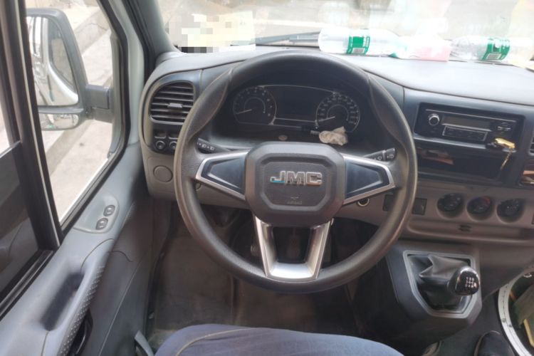 Used JMC Transit 2019 2.8T Commercial Version Long Wheelbase Mid-Roof 6-Seater Rear Single Tire China VI Emission Standard – JX493 Steering Wheel