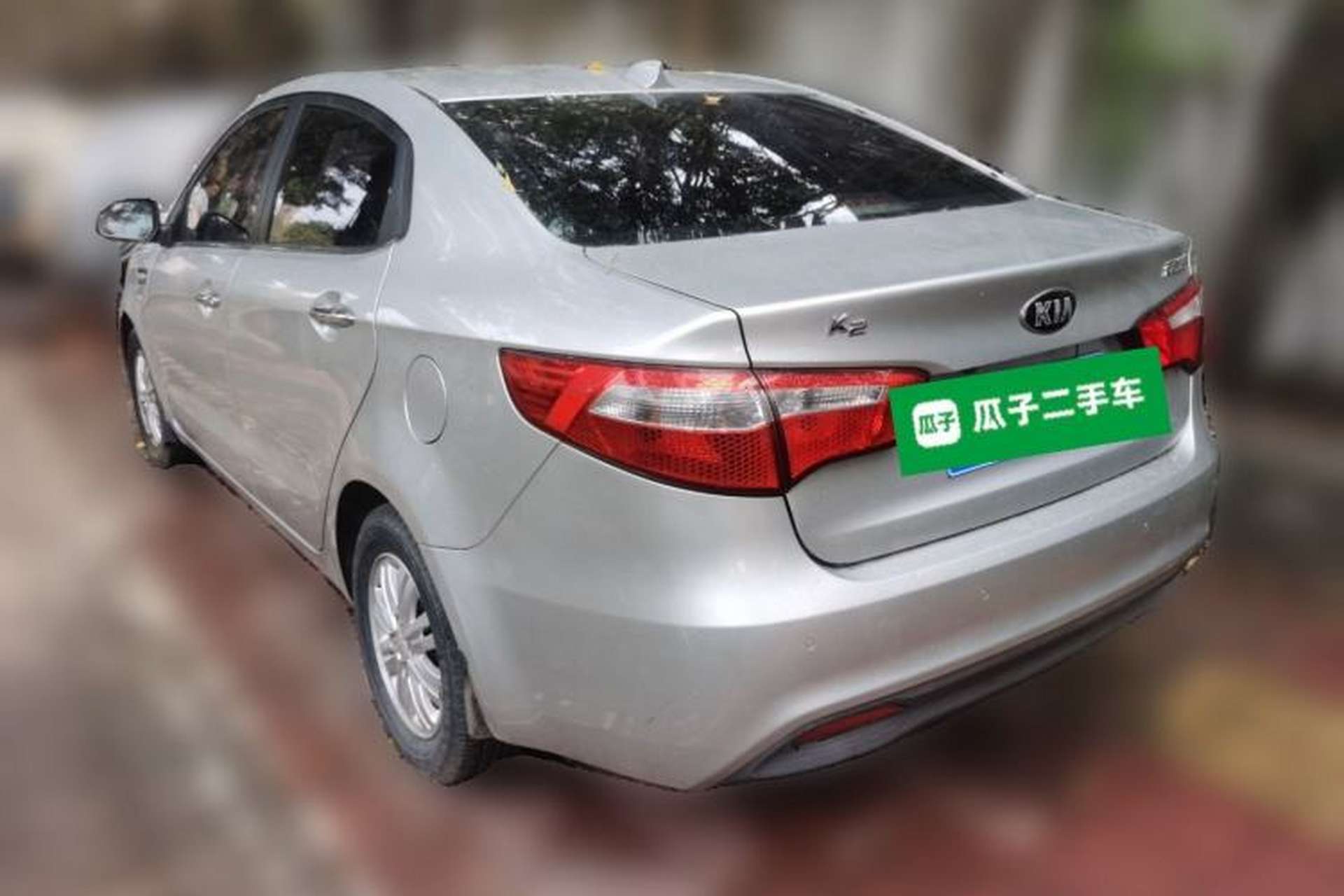 Used Kia K2 2012 Sedan 1.4L Automatic GLS Commemorative Edition Rear Left 45 Deg