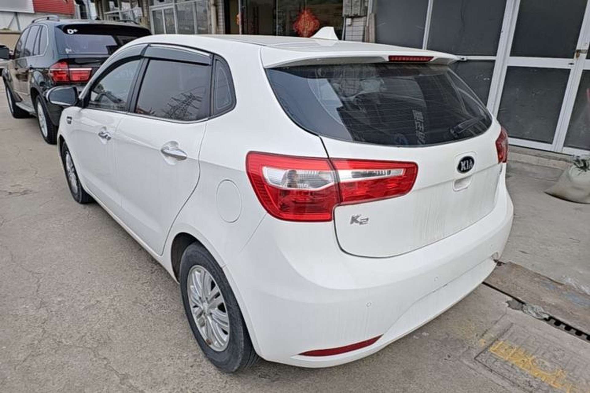 Used Kia K2 2012 Hatchback 1.4L Automatic Cool Edition Rear Left 45 Deg