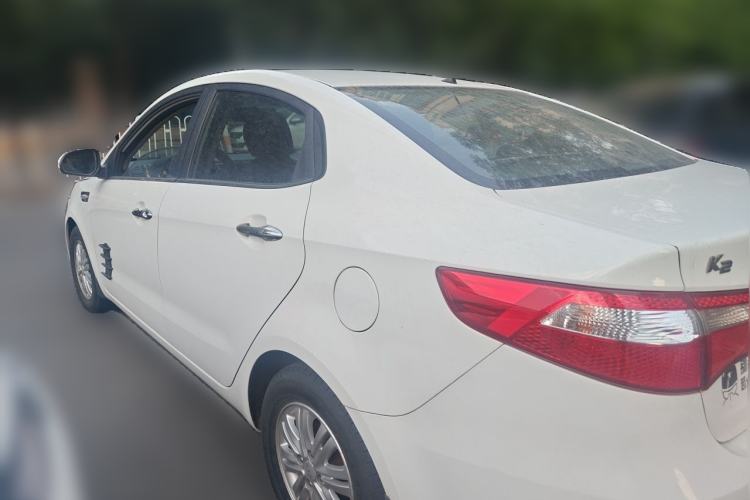 Used Kia K2 2012 Sedan 1.4L Automatic GLS Commemorative Edition Rear Left 45 Deg