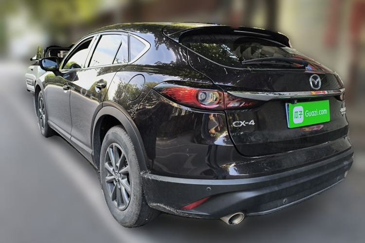 Used Mazda CX-4 2021 2.0L Automatic Two-Wheel Drive Blue Sky Exploration Edition Rear Left 45 Deg