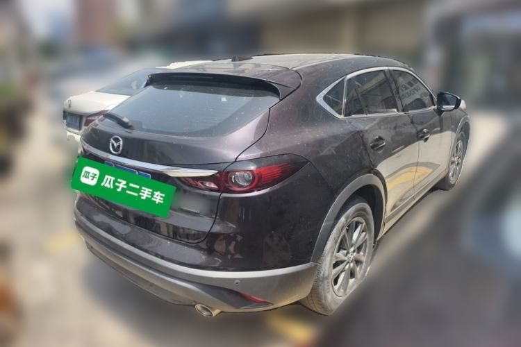 Used Mazda CX-4 2021 2.0L Automatic Two-Wheel Drive Blue Sky Dynamic Edition Rear Right 45 Deg
