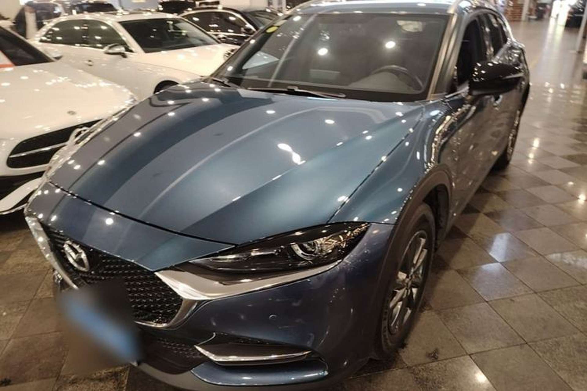 Used Mazda CX-4 2021 2.0L Automatic Two-Wheel Drive Blue Sky Luxury Edition Front Left 45 Deg