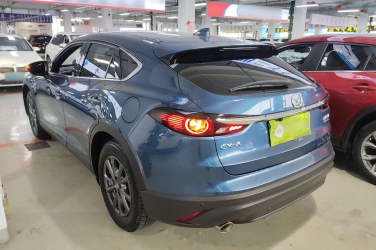 Used Mazda CX-4 2021 2.0L Automatic Two-Wheel Drive Blue Sky Dynamic Edition Rear Left 45 Deg