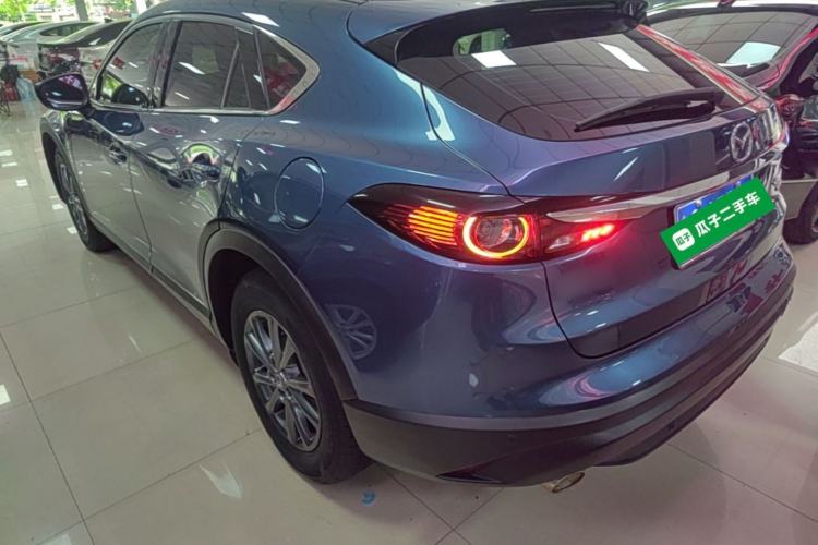Used Mazda CX-4 2021 2.0L Automatic Two-Wheel Drive Blue Sky Exploration Edition Rear Left 45 Deg