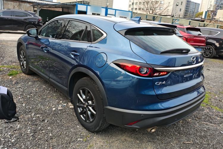 Used Mazda CX-4 2021 2.0L Automatic Two-Wheel Drive Blue Sky Exploration Edition Rear Left 45 Deg