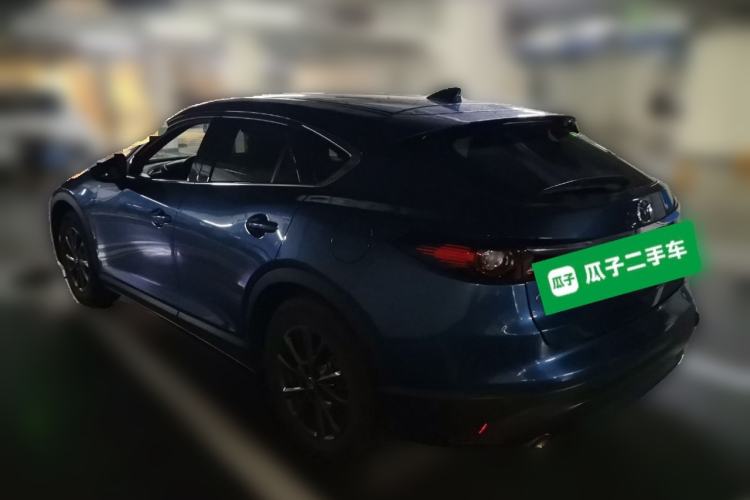 Used Mazda CX-4 2021 2.0L Automatic Two-Wheel Drive Blue Sky Dynamic Edition Rear Left 45 Deg