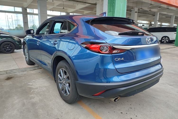 Used Mazda CX-4 2021 2.0L Automatic Two-Wheel Drive Blue Sky Exploration Edition Rear Left 45 Deg