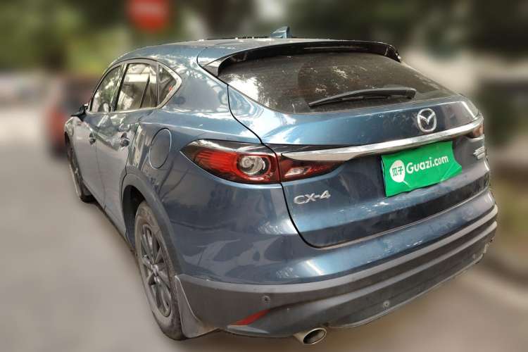 Used Mazda CX-4 2021 2.0L Automatic Two-Wheel Drive Blue Sky Dynamic Edition Rear Left 45 Deg