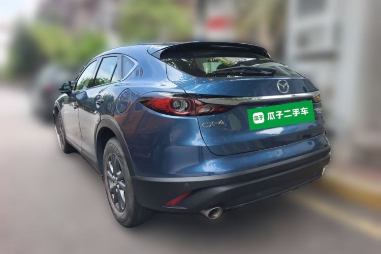 Used Mazda CX-4 2021 2.0L Automatic Two-Wheel Drive Blue Sky Dynamic Edition Rear Left 45 Deg