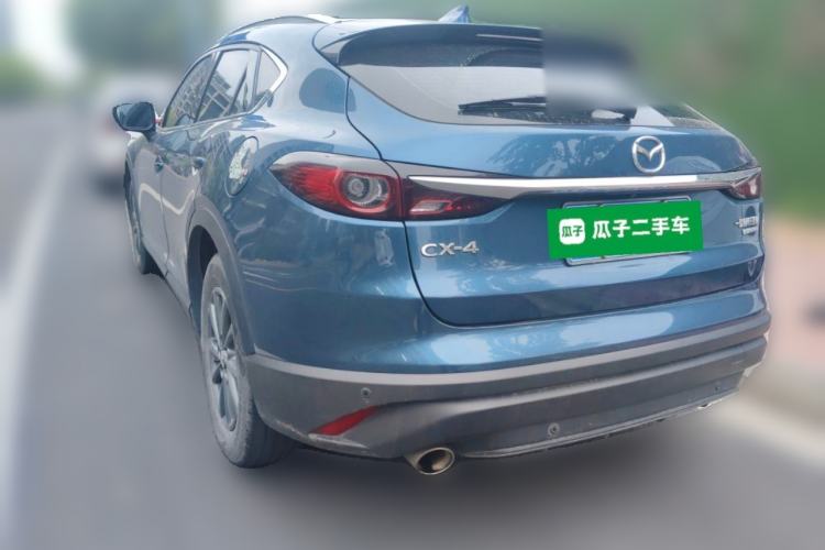 Used Mazda CX-4 2021 2.0L Automatic Two-Wheel Drive Blue Sky Luxury Edition Rear Left 45 Deg
