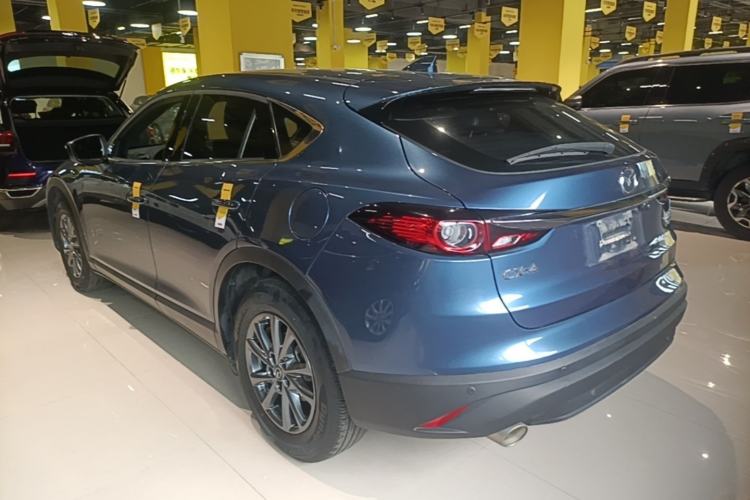 Used Mazda CX-4 2021 2.0L Automatic Two-Wheel Drive Blue Sky Dynamic Edition Rear Left 45 Deg