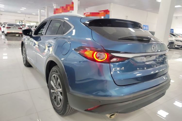 Used Mazda CX-4 2021 2.0L Automatic Two-Wheel Drive Blue Sky Luxury Edition Rear Left 45 Deg