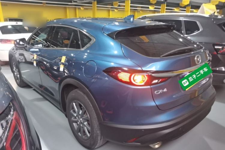 Used Mazda CX-4 2021 2.0L Automatic Two-Wheel Drive Blue Sky Dynamic Edition Rear Left 45 Deg