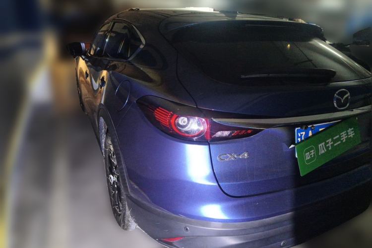 Used Mazda CX-4 2021 2.0L Automatic Two-Wheel Drive Blue Sky Exploration Edition Rear Left 45 Deg