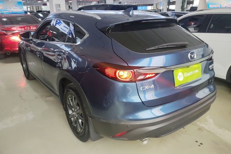 Used Mazda CX-4 2021 2.0L Automatic Two-Wheel Drive Blue Sky Dynamic Edition Rear Left 45 Deg