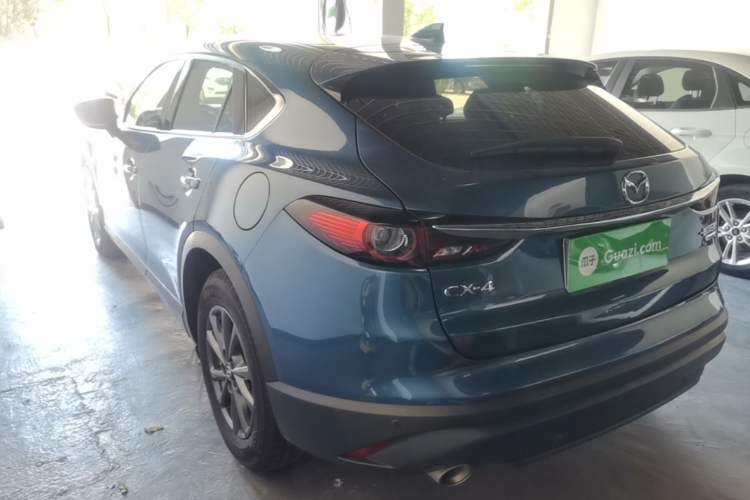 Used Mazda CX-4 2021 2.0L Automatic Two-Wheel Drive Blue Sky Exploration Edition Rear Left 45 Deg