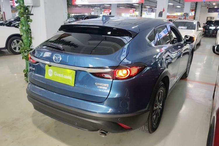 Used Mazda CX-4 2021 2.0L Automatic Two-Wheel Drive Blue Sky Dynamic Edition Rear Right 45 Deg