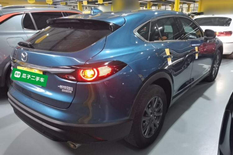 Used Mazda CX-4 2021 2.0L Automatic Two-Wheel Drive Blue Sky Dynamic Edition Rear Right 45 Deg