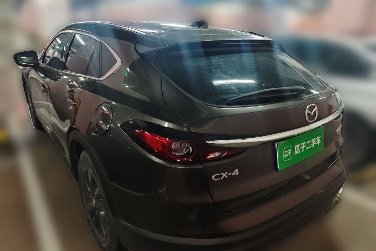 Used Mazda CX-4 2021 2.0L Automatic Two-Wheel Drive Blue Sky Dynamic Edition Rear Left 45 Deg