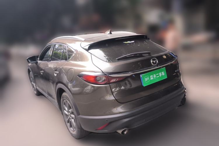 Used Mazda CX-4 2021 2.0L Automatic Two-Wheel Drive Blue Sky Luxury Edition Rear Left 45 Deg