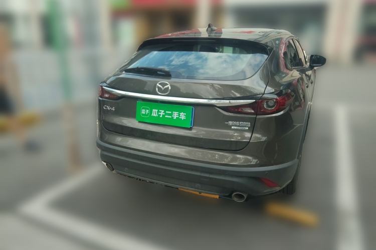 Used Mazda CX-4 2021 2.0L Automatic Two-Wheel Drive Blue Sky Exploration Edition Rear Right 45 Deg