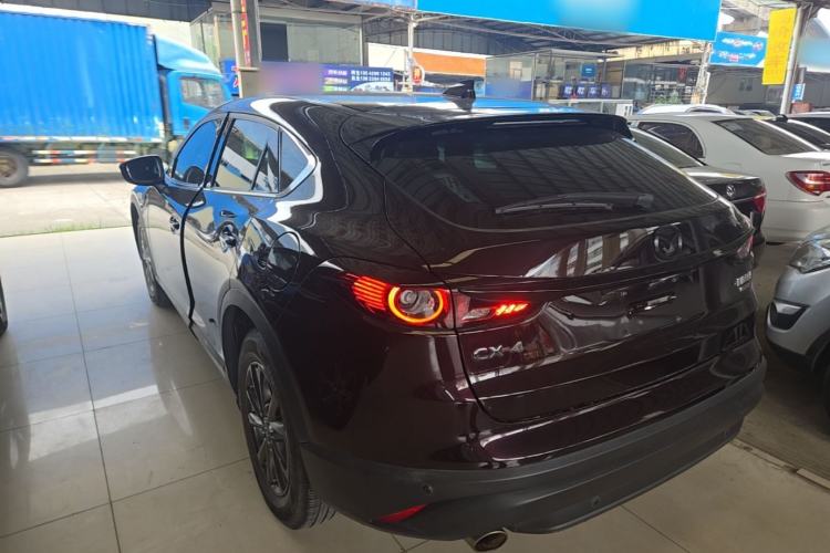 Used Mazda CX-4 2021 2.0L Automatic Two-Wheel Drive Blue Sky Exploration Edition Rear Left 45 Deg
