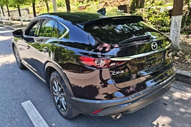 Used Mazda CX-4 2021 2.0L Automatic Two-Wheel Drive Blue Sky Dynamic Edition Rear Left 45 Deg