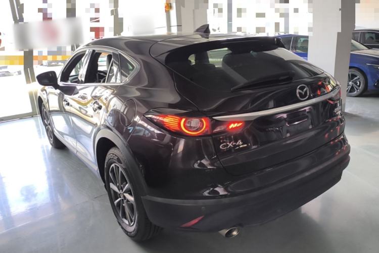 Used Mazda CX-4 2021 2.0L Automatic Two-Wheel Drive Blue Sky Dynamic Edition Rear Left 45 Deg