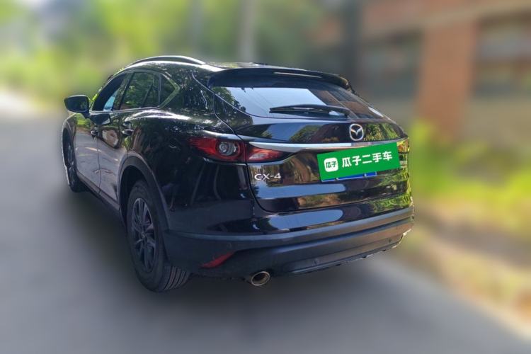 Used Mazda CX-4 2021 2.0L Automatic Two-Wheel Drive Blue Sky Luxury Edition Rear Left 45 Deg