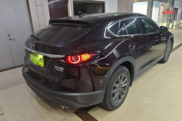 Used Mazda CX-4 2021 2.0L Automatic Two-Wheel Drive Blue Sky Dynamic Edition Rear Right 45 Deg